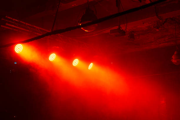 concert stage with red spot light and smoke