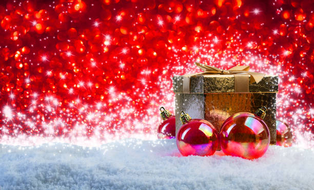 istock Christmas present with balls, shiny stars and snow. 1447652990