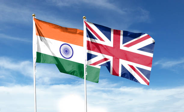 istock Indian flag and British flag on cloudy sky. waving in the sky 1447656157