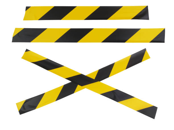 istock Yellow and black adhesive tapes isolated on white 1447656884
