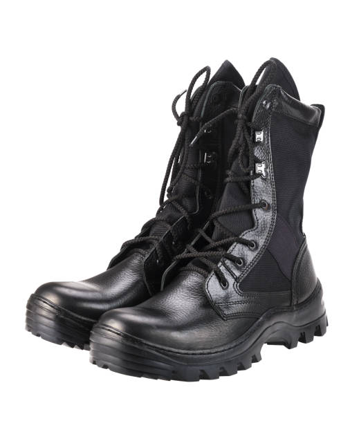 istock A pair of new black combat boots isolated on a white background. 1447657683