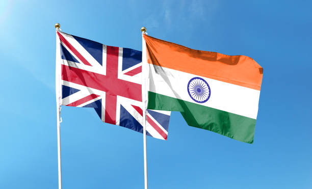 istock Indian flag and British flag on cloudy sky. waving in the sky 1447657914