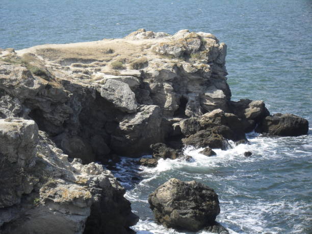istock rock washed by sea water 1447658036