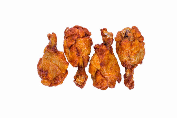 istock Fried chicken legs on a white plate. Horizontal orientation 1447658753