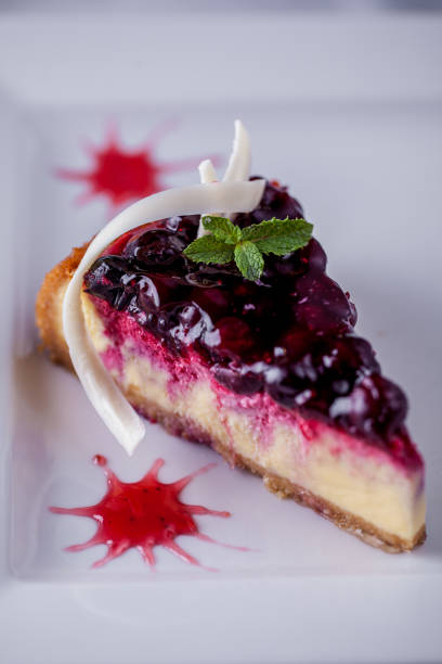 istock Cheese casserole with currants, white chocolate shavings and mint on a white plate. Vertical orientation 1447662190