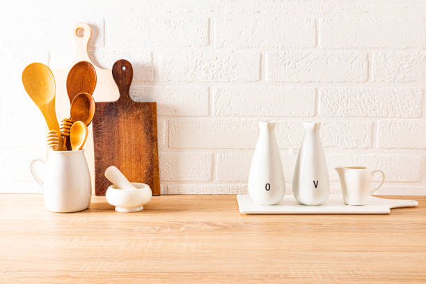 istock stylish modern kitchen background. environmentally friendly items on a wooden countertop against a white brick wall. kitchen decor concept. 1447663516