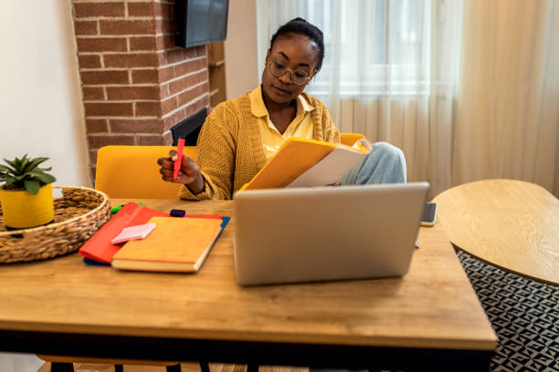 istock Young African American female student studying at home. 1447665742