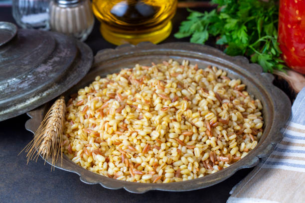 Traditional delicious Turkish food, bulgur pilaf with vermicelli (Turkish name; arpa sehriyeli bulgur pilavi) Traditional delicious Turkish food, bulgur pilaf with vermicelli (Turkish name; arpa sehriyeli bulgur pilavi) ARPA stock pictures, royalty-free photos & images