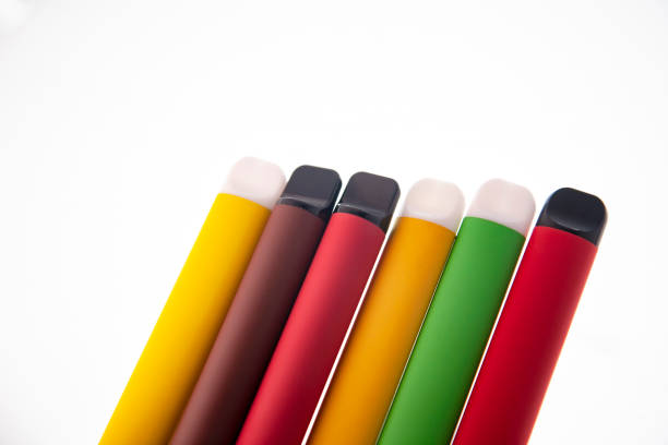 istock E-SMOKE. E-VAPE. Electronic cigarette sticks isolated on white background. 1447669229