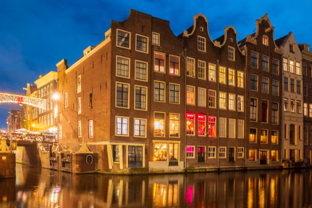 istock Amsterdam canals during a winter evening with illuminated merchant's houses 1447670255