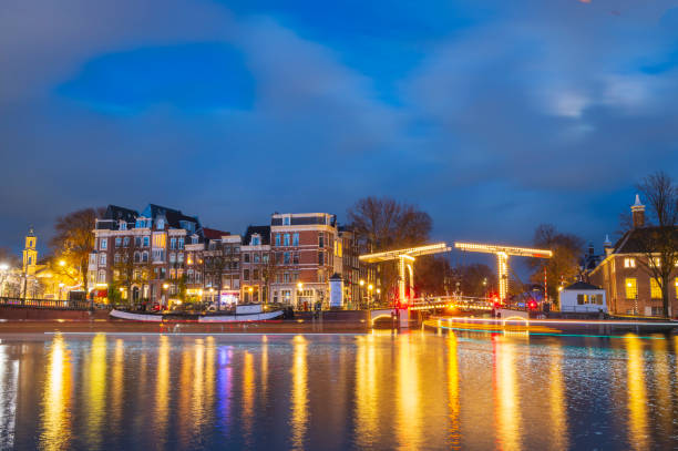 istock Amsterdam illuminated bridges at the Amstel river during winter 1447671559