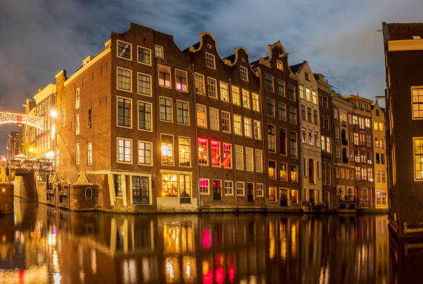 istock Amsterdam canals during a winter evening with illuminated merchant's houses 1447671633
