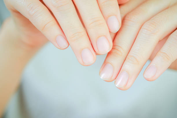 istock Close-up of woman's fingernail. Hand concept. 1447673146