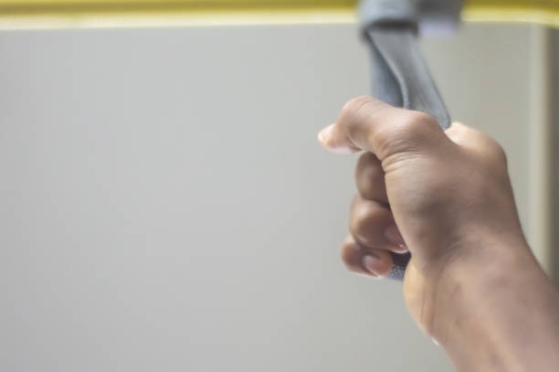 istock Hand Hold on to a Handle Bar on a Public Transportation 1447673304