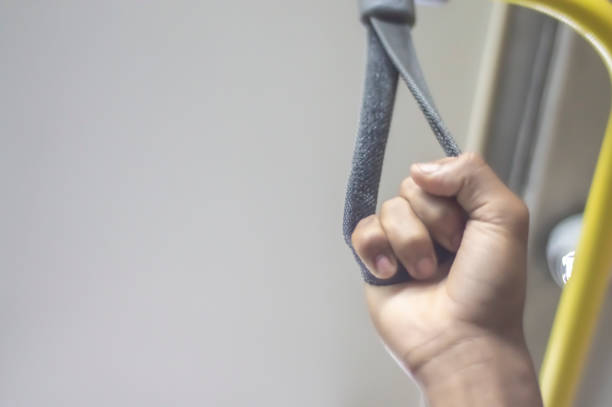 istock Hand Hold on to a Handle Bar on a Public Transportation 1447673310