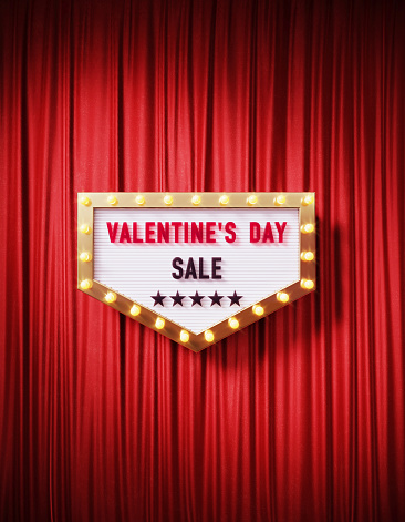 Valentine's Day Sale written retro billboard with glowing light bulbs on red curtain background with shadow. Vertical composition. 3D rendering.