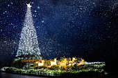 Shiny outdoor Christmas Tree and stars of Universe