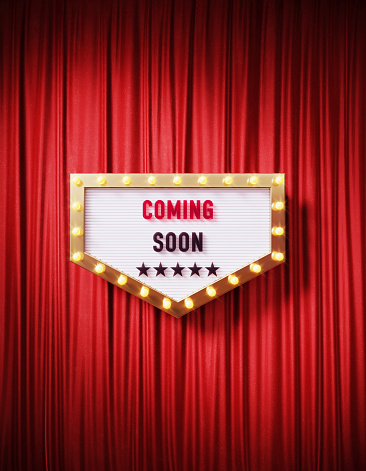 Coming soon written retro billboard with glowing light bulbs on red curtain background with shadow. Vertical composition. 3D rendering.