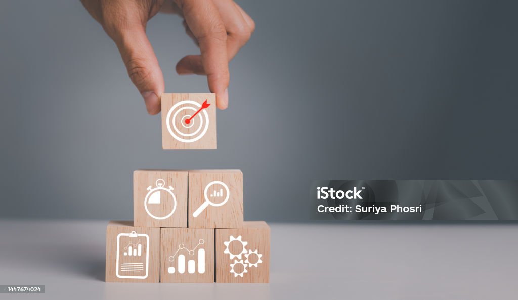 business strategy, Action plan, Goal and target, hand stack woods block step on table with icon about business strategy and Action plan. business development concept. Strategy Stock Photo business strategy, Action plan, Goal and target, hand stack woods block step on table with icon about business strategy and Action plan. business development concept. Strategy Stock Photo
