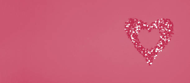 istock Heart shaped frame made of shiny sequins on a blue background. Festive texture for Valentines Day, Mothers Day, Womens Day, day of the wedding and Birthday. Banner, Flatlay, copy space. 1447674090