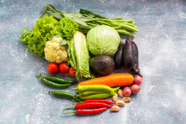 istock Different vegetable healthy food on wood table. 1447674693