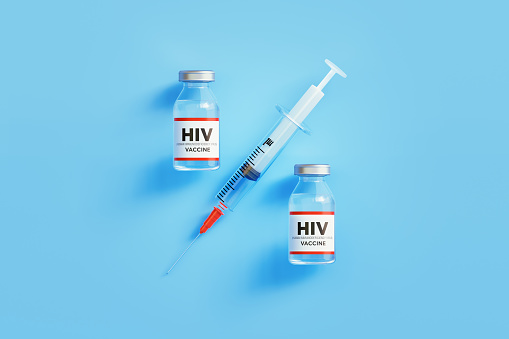 HIV Vaccine and Syringe Forming Percentage Sign on Blue Background