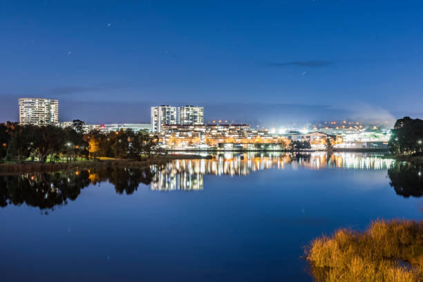 Night scape at Belconnen in Canberra. From lakeside of Lake Ginninderra to see shopping centre of Belconnen. belconnen stock pictures, royalty-free photos & images