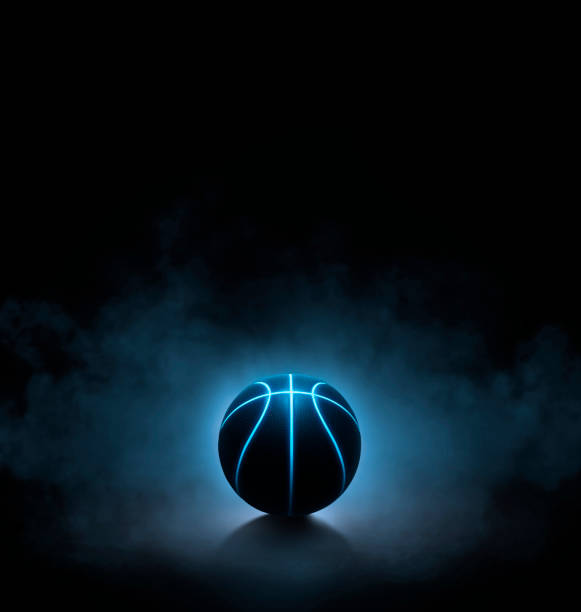 istock black basketball with bright blue glowing neon lines on black background with smoke. 3d render 1447680111
