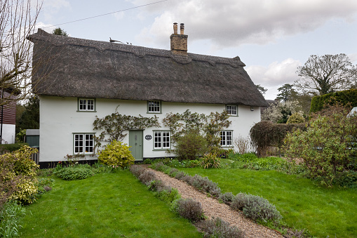 Thatched cottage seen in the Northamptonshire village of Blisworth, taken 12th May 2022.