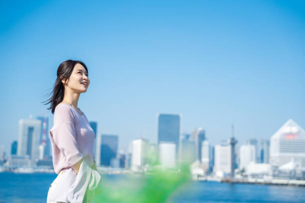 istock Businesswoman walking outside with her jacket off 1447681579