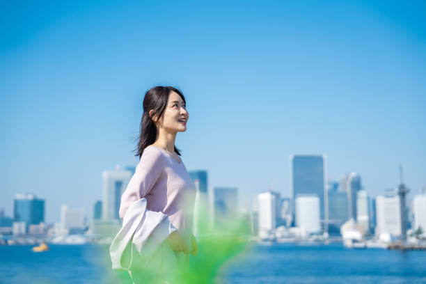 istock Businesswoman walking outside with her jacket off 1447681670