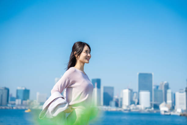 istock Businesswoman walking outside with her jacket off 1447681683