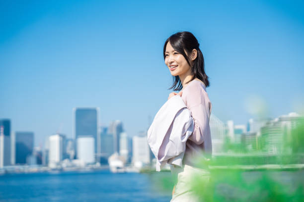 istock Businesswoman walking outside with her jacket off 1447681744