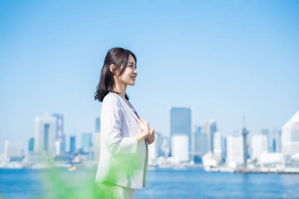 istock Businesswoman walking outside with her jacket off 1447681767