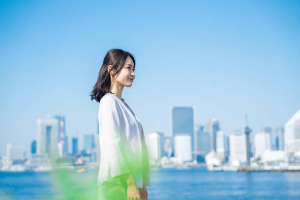istock Businesswoman walking outside with her jacket off 1447681772