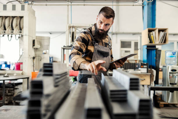 istock An industry worker checking on bus construction in vehicle production factory. 1447681820
