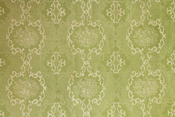 istock Old wallpaper on the wall. Old wallpaper for texture or background. 1447683853