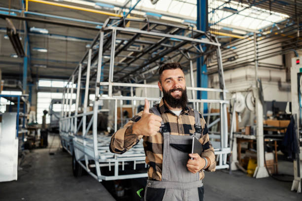 istock An industry worker checking on bus construction in vehicle production factory. 1447683926