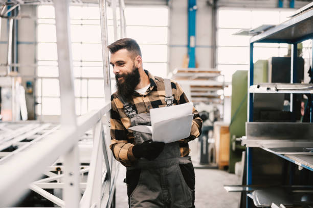 istock An industry worker checking on bus construction in vehicle production factory. 1447684790