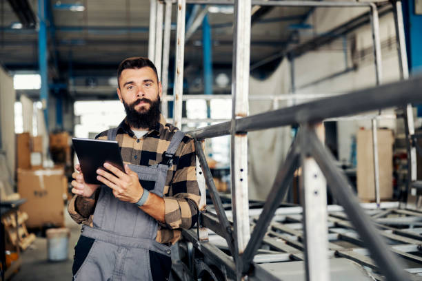 istock An industry worker checking on bus construction in vehicle production factory. 1447684948