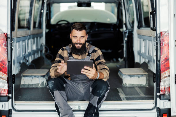 istock An industry worker checking on bus construction in vehicle production factory. 1447685436