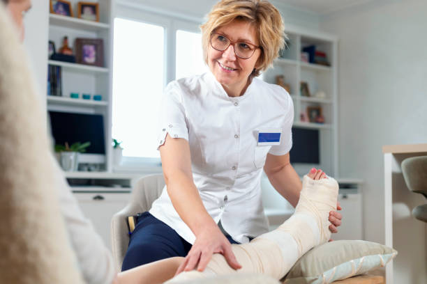 istock Physical therapist in home visit 1447685741