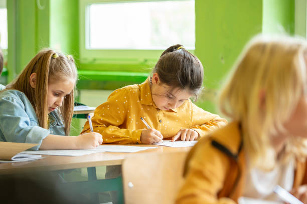 istock Schoolgirls learning in the classroom 1447689301