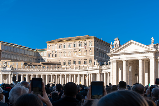 Vatican City, Vatican - 27 November, 2022: large crowd in Saint Peter's Square listening to Pope Francis during his prayers