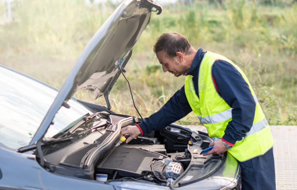 istock man broken car yellow vest street 1447691857