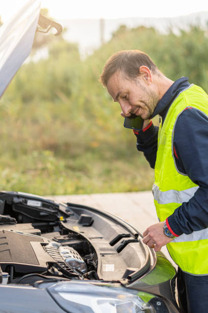 istock man broken car talking phone street 1447691868