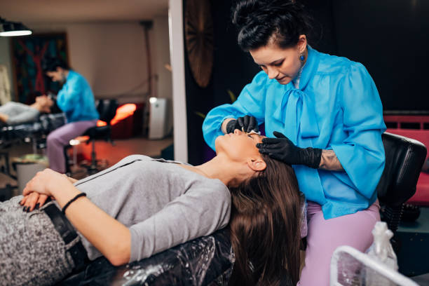 istock The beautician applies a cream that will alleviate the irritation after applying a permanent pigment on the eyebrows 1447691965