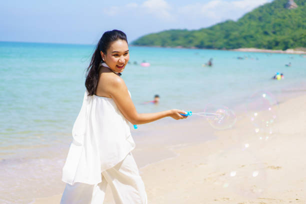 istock Woman playing with a soap bubble. 1447694187