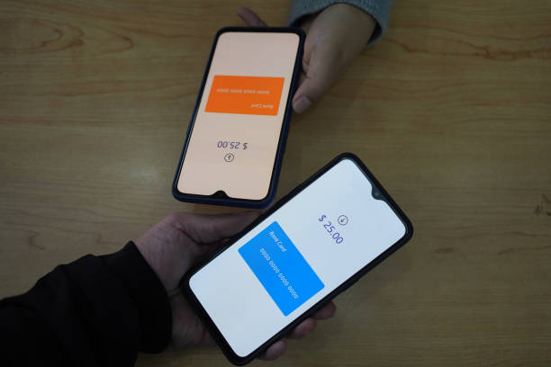 istock Asian man using smartphone to transfer money 1447694196