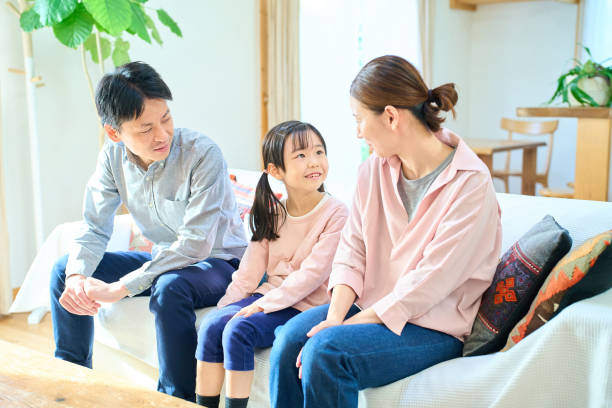 istock parents and their childr talking happily 1447696740